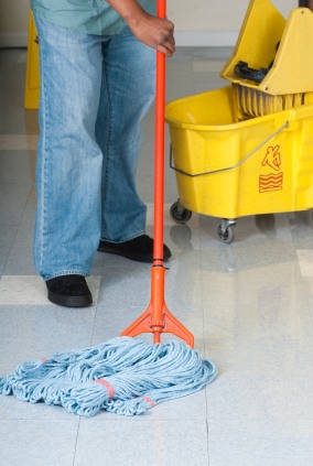 Jay Mckenna Cleaning Services, LLC janitor in Hooksett, NH mopping floor.
